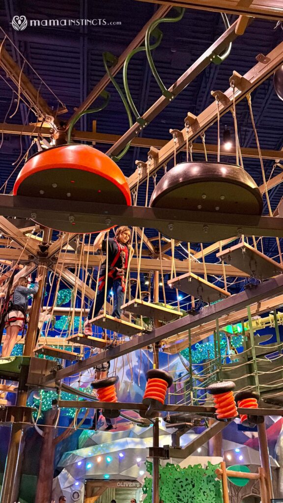 Tween girl climbs the Great Wolf Lodge Naples indoor ropes course 
